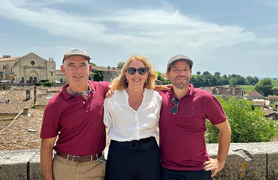 A traveler taking a picture with the tour leaders.